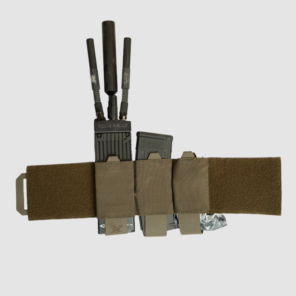 Night Heron Israel X-Ray elastic cummerbund in olive drab with MOLLE pouches holding magazines and radio antennas.